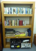 A modern light oak finished four tier open bookcase, on a plinth  71"h  48"w