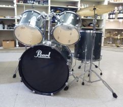 A Pearl Forum Series five piece drum kit with seat and drumsticks