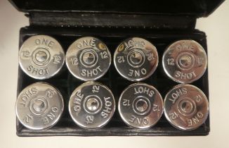 A set of eight numbered, clear glass 'One Shot' butt markers with threaded silver caps, fashioned as