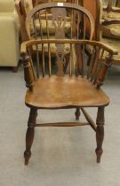 A mid 19thC oak and elm framed, low hoop, spindled back Windsor arm chair with a pierced splat,