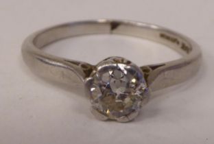 A platinum claw set diamond solitaire ring