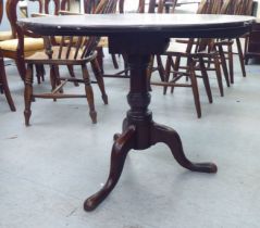 A 19thC and later beech and mahogany pedestal table, the top rotating on a turned column, raised