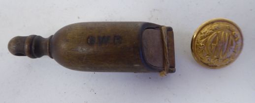 A 19thC Great Western Railway guards wooden whistle with an impressed mark; and a later GWR
