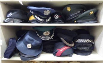 Military and other, mainly 20thC headgear: to include peaked caps (Please Note: this lot is