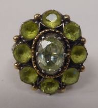 A gold coloured metal peridot set cluster ring