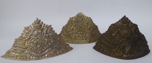 Three similar brass tchapka helmet plates, viz. Royal Irish, Seventeenth Lancers and Royal