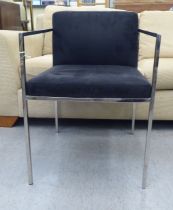 A Kesterport chromium plated framed open arm desk chair, raised on square legs
