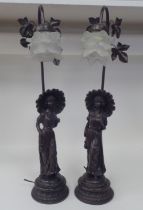 A pair of Edwardian style bronze finished table lamps, each fashioned as a young lady holding a