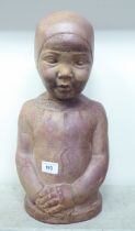 A terracotta bust, a little Dutch girl wearing a cap  bears an indistinctly impressed mark  17"h