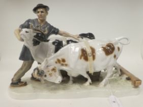 A 1920/1930s Meissen porcelain group, a man wearing rustic clothes, grappling with two wilful