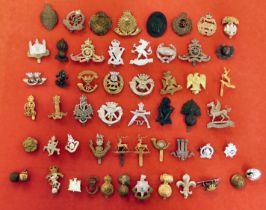 Approx. fifty military and associated cap badges and uniform insignia, some copies: to include REME;