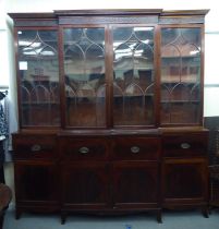A 19thC mahogany breakfront library bookcase with a blindfret carved cornice,