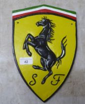 A painted cast iron sign 'Ferrari'  7"w