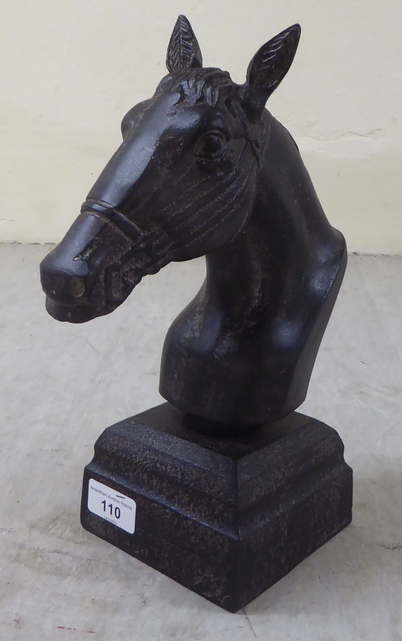 A bronze effect horse's head, on a plinth  11"h