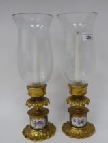 A pair of modern antique French reproduction porcelain cast gilt brass and glazed candlesticks  13.