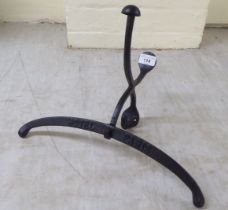 A Parisian hotel inspired, cast iron, wall mounted valet hook  14"w