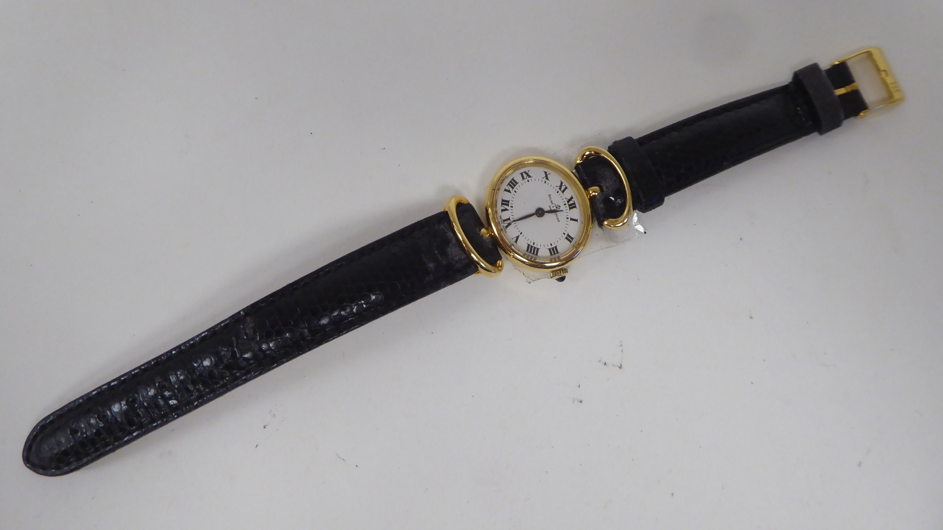 A lady's Baume & Mercia 18ct gold oval cased wristwatch, on a black hide strap - Image 2 of 4