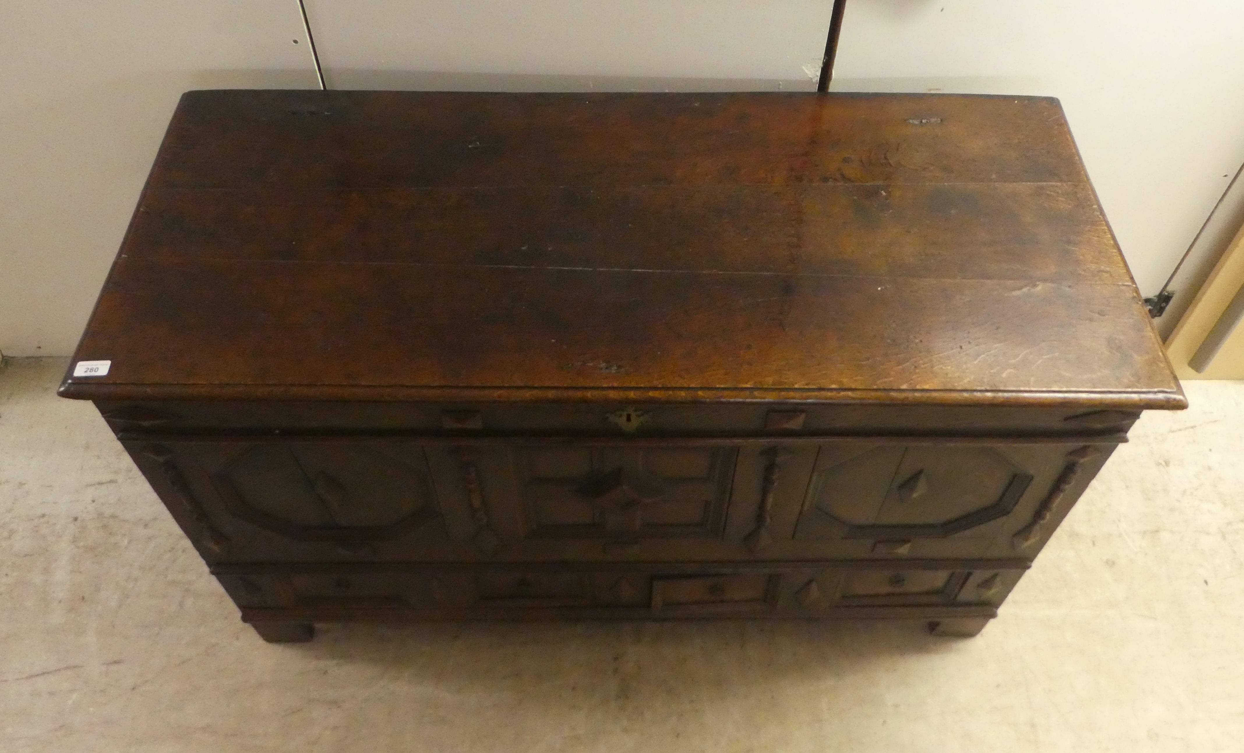 A late 18thC oak coffer with straight sides and a hinged lid, a panelled front and two drawers, - Image 2 of 6