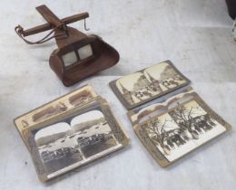 An early 20thC stereoscopic viewer; and viewing cards