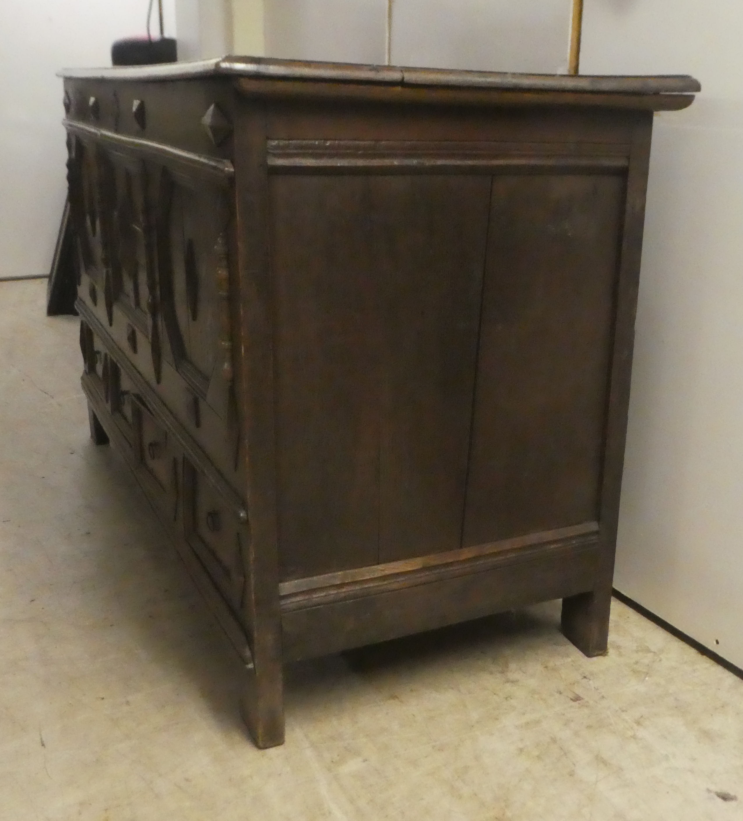 A late 18thC oak coffer with straight sides and a hinged lid, a panelled front and two drawers, - Image 3 of 6
