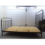 An early 20thC lacquered brass single bed frames, the headboard 48"w with runners and later