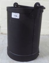 A rivetted cast metal cylindrical bucket