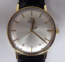 An Omega 9ct gold cased wristwatch, the automatic movement faced by a baton dial, on a black hide