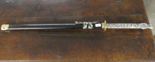 A reproduction Japanese Samurai sword with a composition handle  the blade 29"L (display purposes