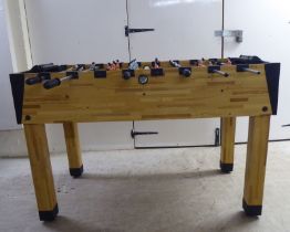 A BCE pine effect foosball table  32"h