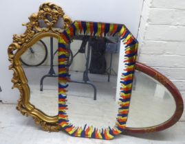 Mirrors: to include a mid 20thC Japanese inspired red painted and gilt framed example  19" x 29"