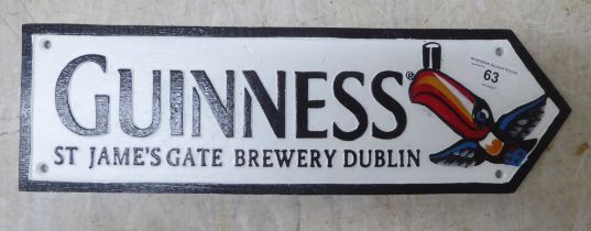 A painted cast iron sign 'Guinness'  14"w