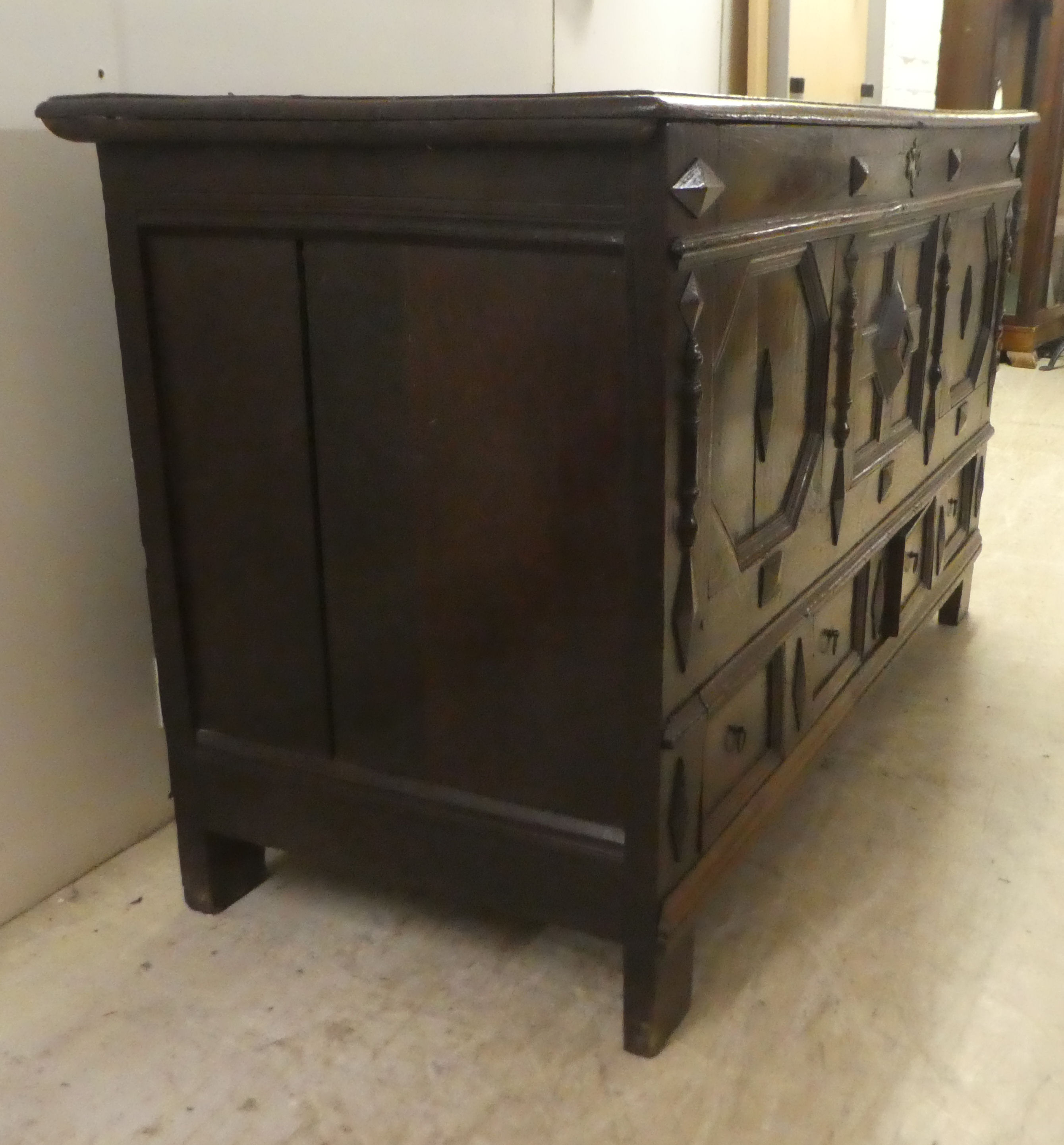 A late 18thC oak coffer with straight sides and a hinged lid, a panelled front and two drawers, - Image 4 of 6