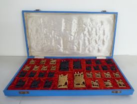 A modern Indian carved softwood complete chess set  cased