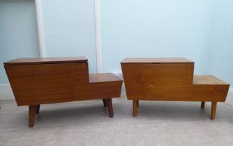 A pair of 1970s teak tables of staggered form with hinged lids and drawer compartments  17"h  29"w