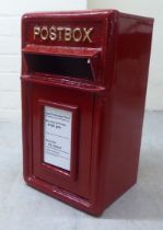 A reproduction wall mounted, red painted, cast iron Royal Mail postbox  17"h  9.5"w  8"deep