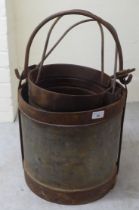 A set of three galvanised metal buckets with swing handles