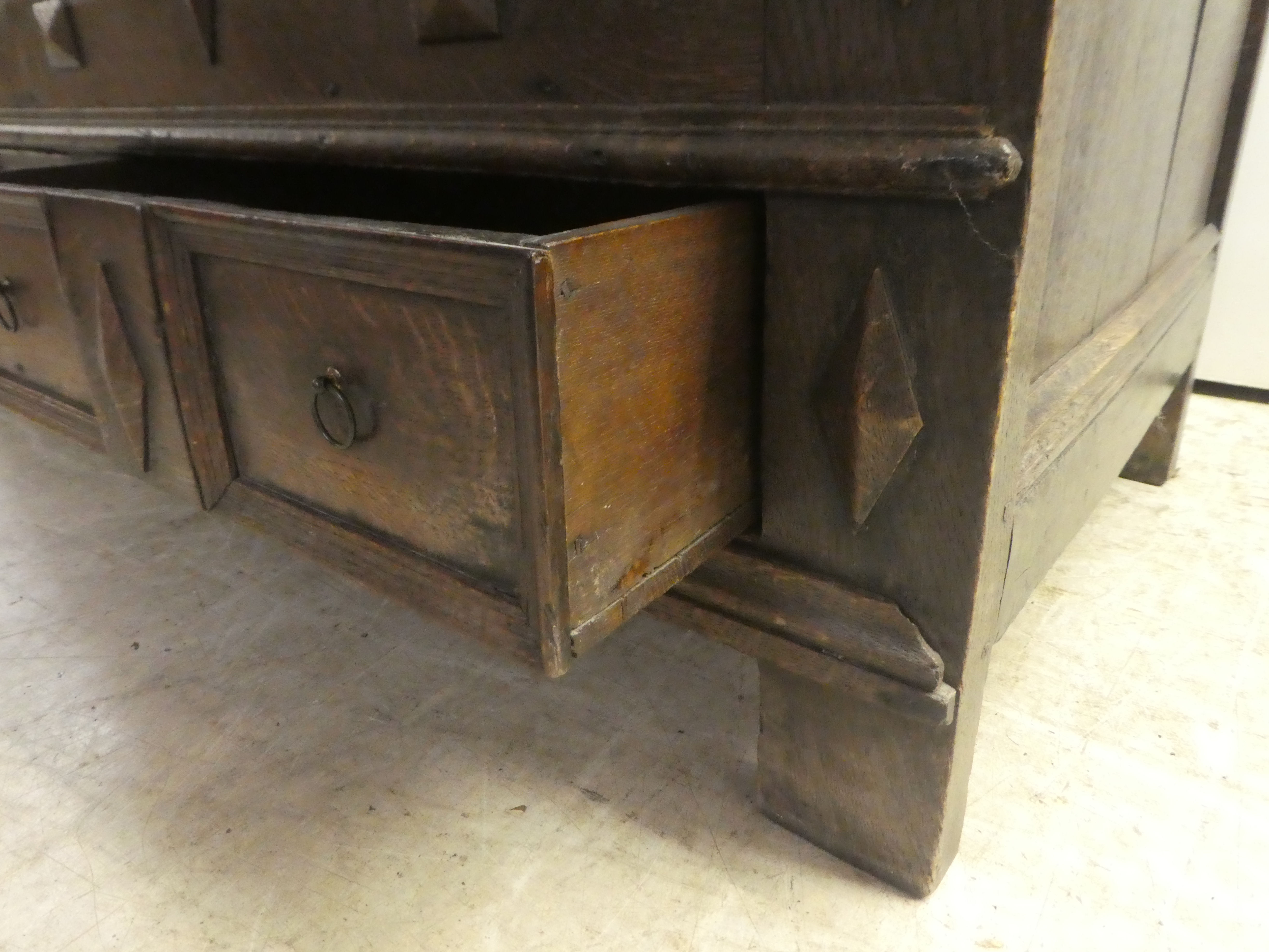 A late 18thC oak coffer with straight sides and a hinged lid, a panelled front and two drawers, - Image 6 of 6