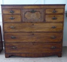 A George III string inlaid mahogany eight drawer dressing chest, raised on bracket feet  44"h  49"w