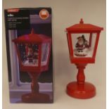 An electric musical snow lantern with Santa  15"h  boxed