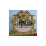 An ornate late 19th Century gold painted overmantel mirror.