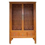 An Asian hardwood wardrobe.