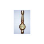 A Victorian walnut wall barometer.