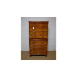 A Georgian-style burr walnut and walnut chest on chest.