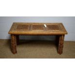 An Asian carved and pierced hardwood display table.