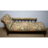 An Edwardian carved and stained beech button-back chaise longue.