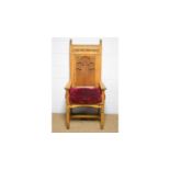 A substantial Victorian-style carved oak ceremonial armchair.