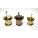 A selection of three brass pestle and mortars.