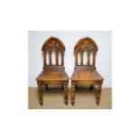 A pair of ‘Siesta’ Victorian-style oak hall chairs.