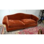 A large camel back sofa by Peter Dudgeon.