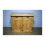 A Victorian-style pine side cabinet.